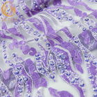 La púrpura goteó el bordado hecho a mano de la tela del cordón soluble en agua para la ropa