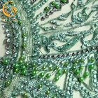 La tela moldeada verde sofisticada del cordón/ata la tela material para el vestido nupcial